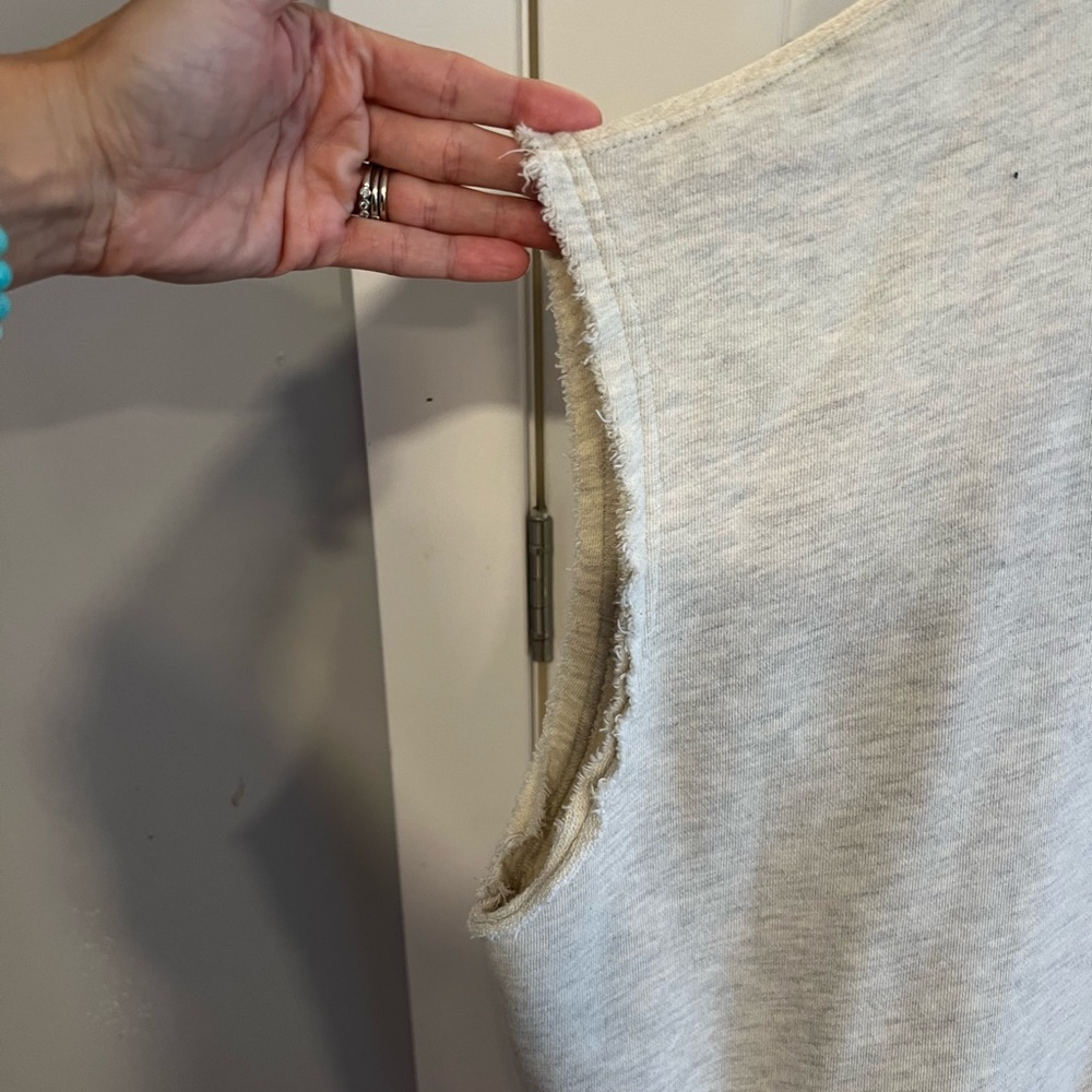 Cream sleeveless sweatshirt